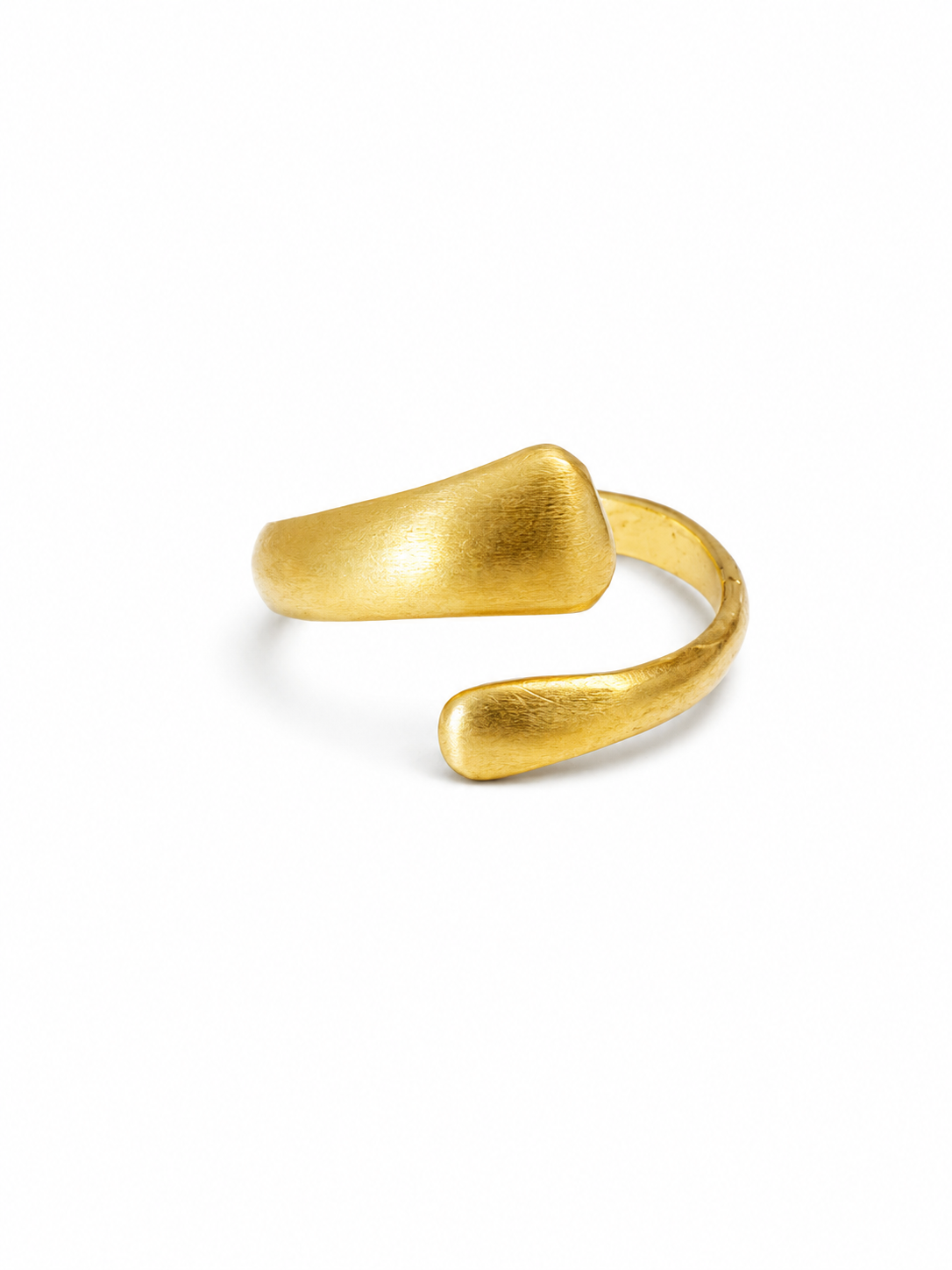 A minimalist silver open-bend ring with a textured, organic matte finish, photographed on a seamless white background.
