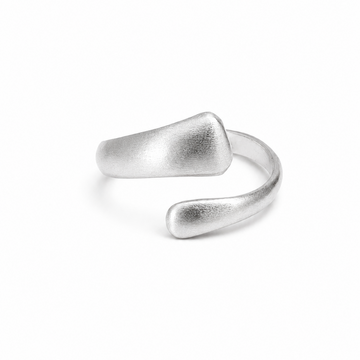 A minimalist silver open-bend ring with a textured, organic matte finish, photographed on a seamless white background.