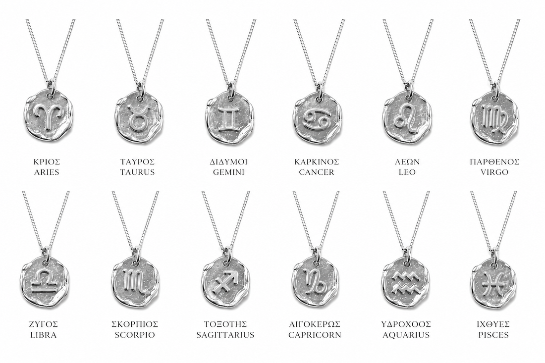 Silver necklace with a zodiac pendant on a white background