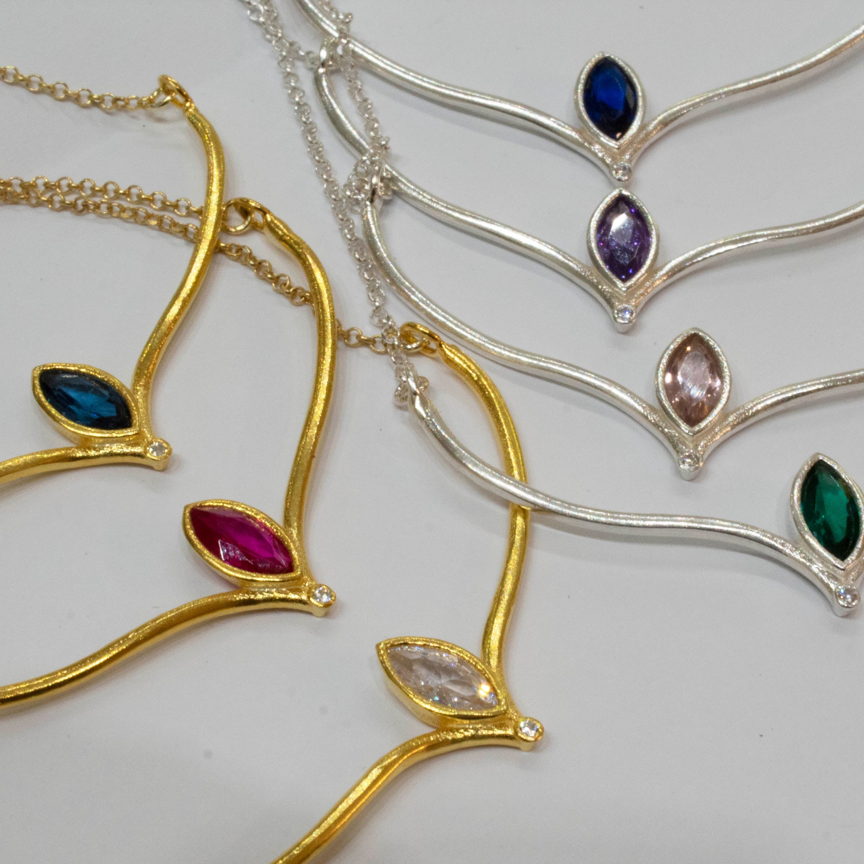 Necklaces with gemstones on a white background