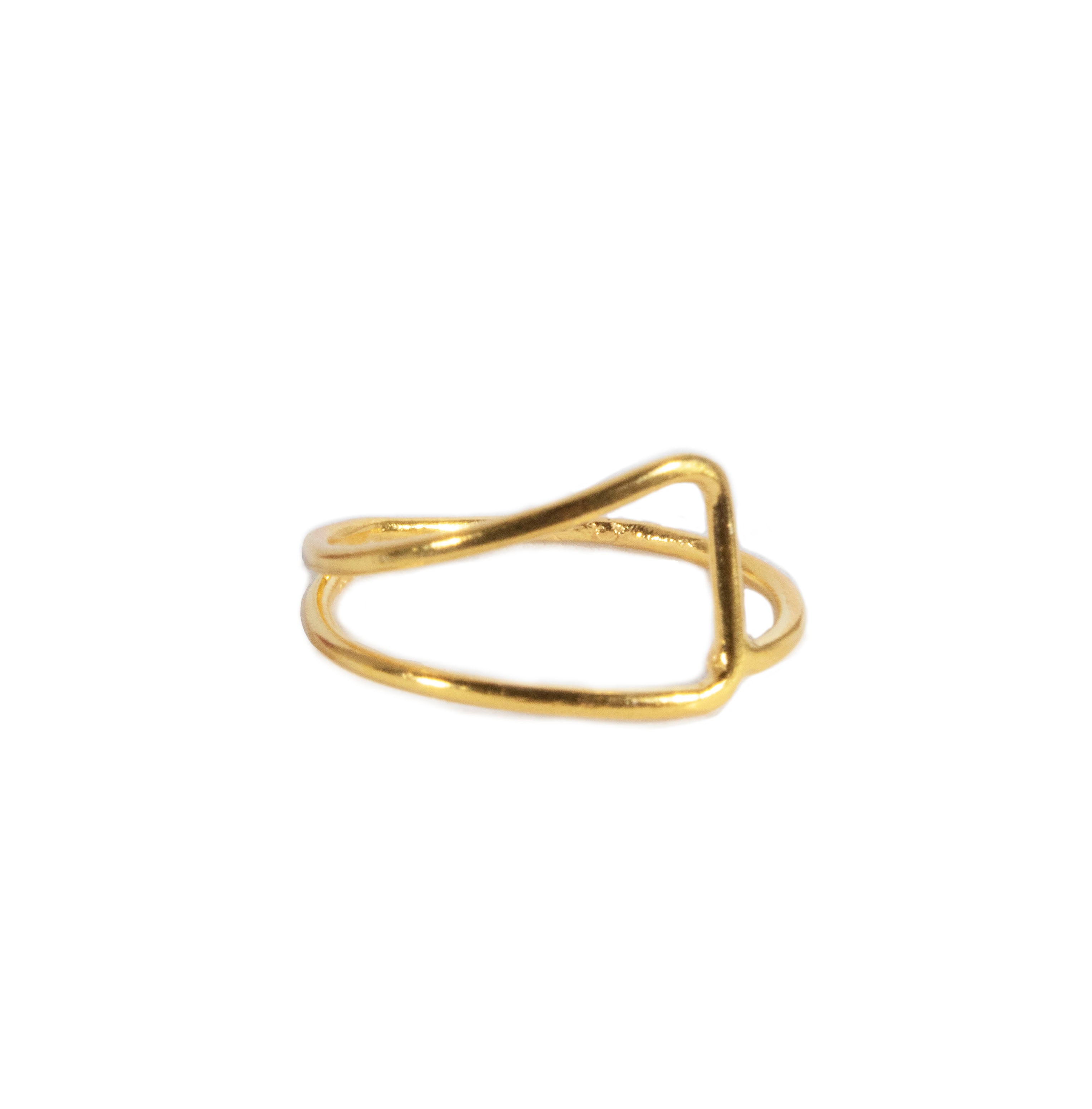 Gold ring with a unique design on a white background