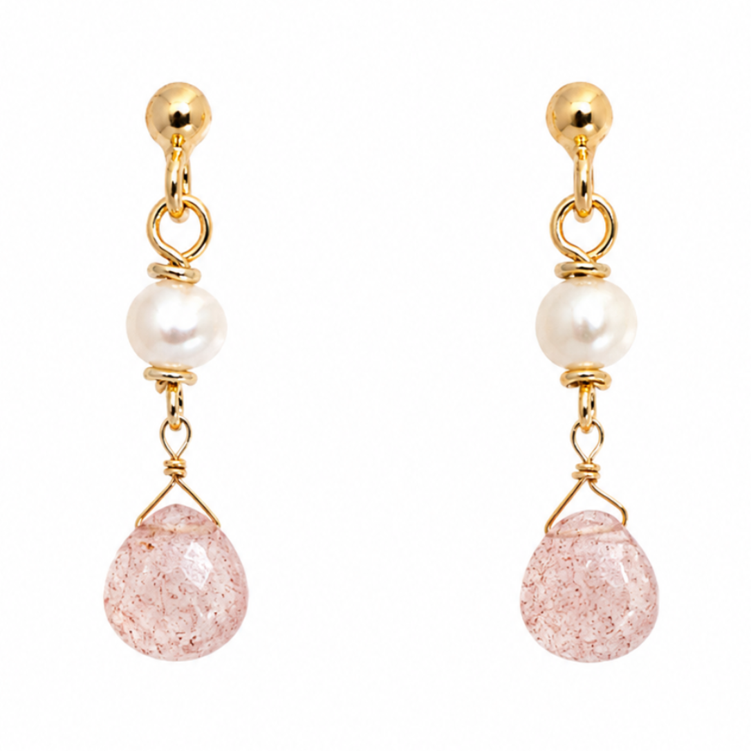 A pair of gold drop earrings featuring a white pearl, a teardrop-shaped pink crackle quartz stone, and a small gold ball stud at the top, shown against a plain white background.