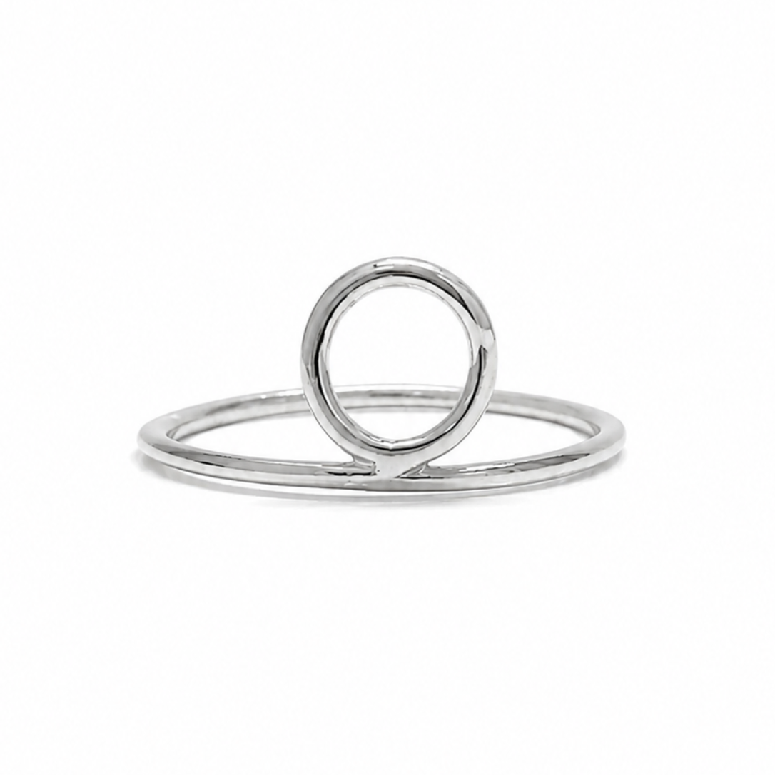 Silver ring with a circular design on a white background