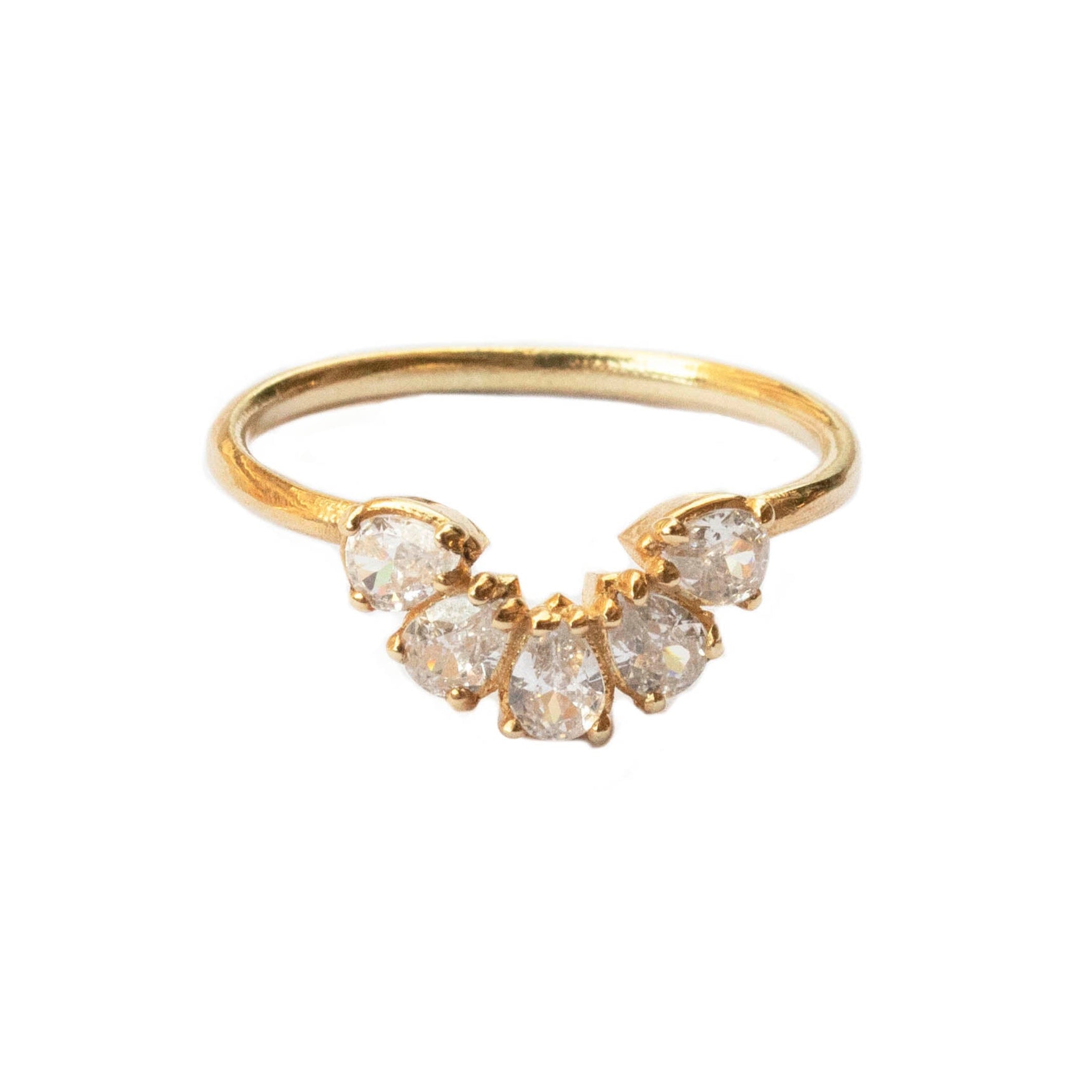 Gold ring with diamond-shaped stones on a white background