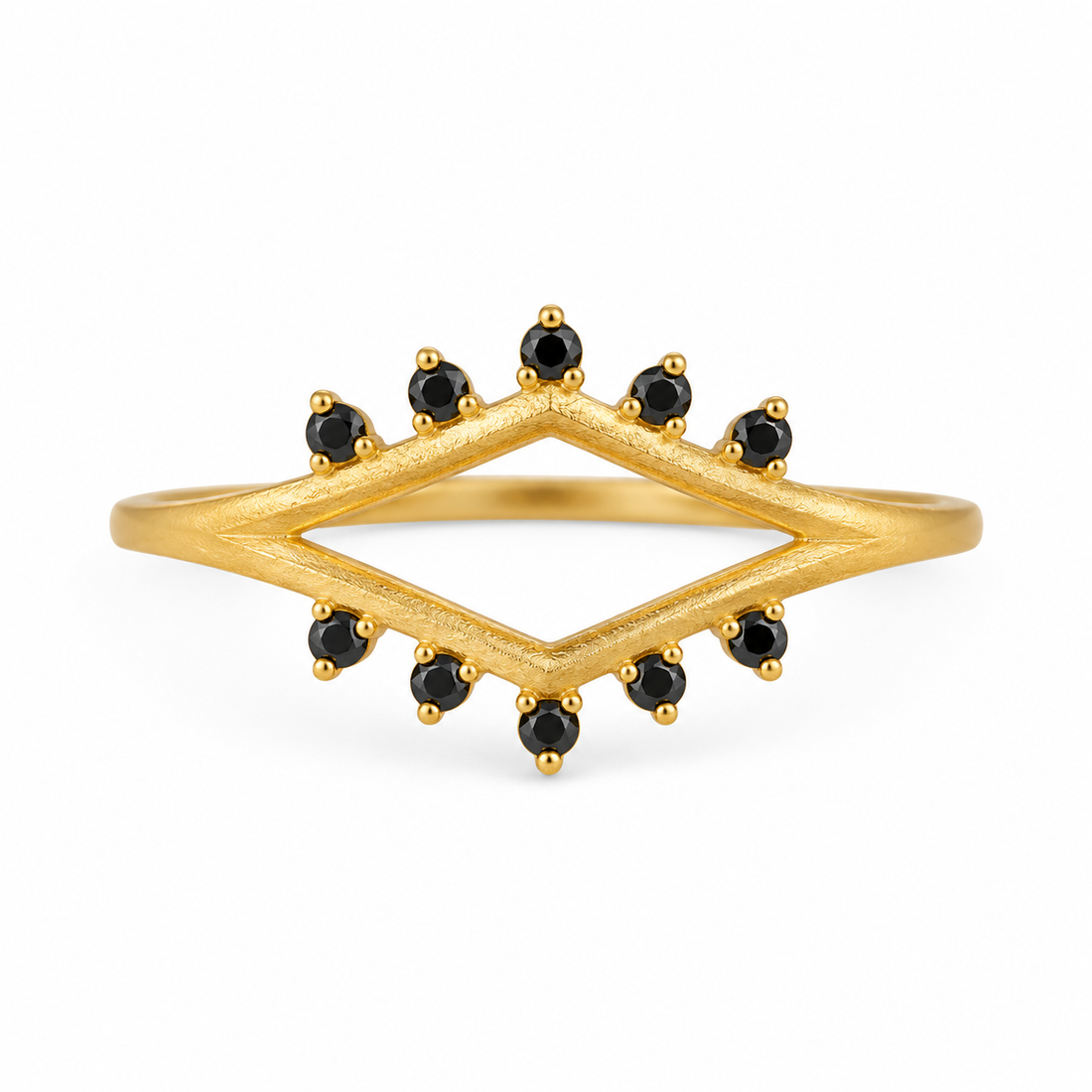 Gold ring with black gemstones on a white background