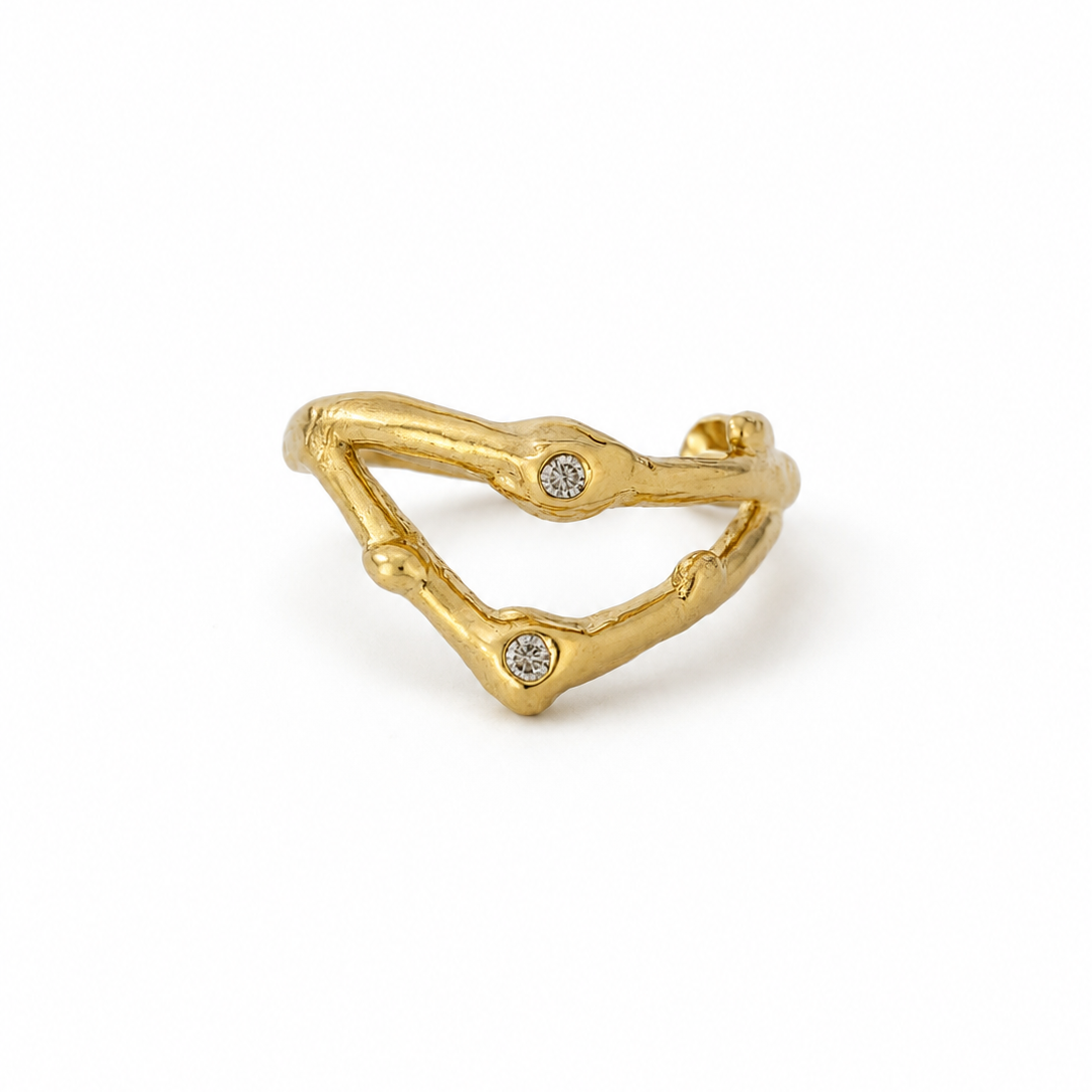 Gold ring with small diamonds on a white background