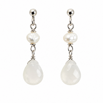 A pair of silver drop earrings featuring a small white pearl, a faceted white teardrop stone, and polished silver posts, shown against a plain white background.