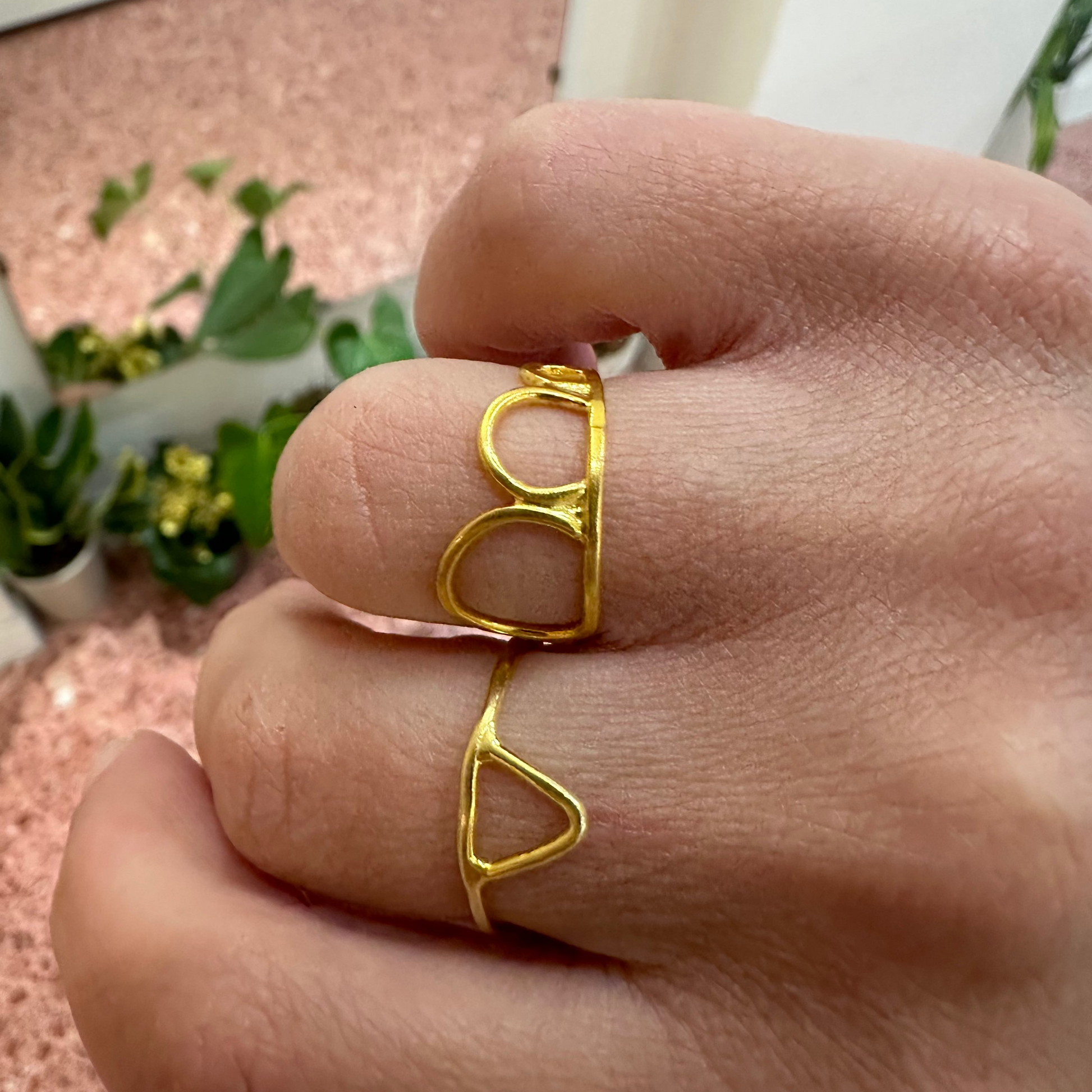 Gold ring on a finger with a blurred background