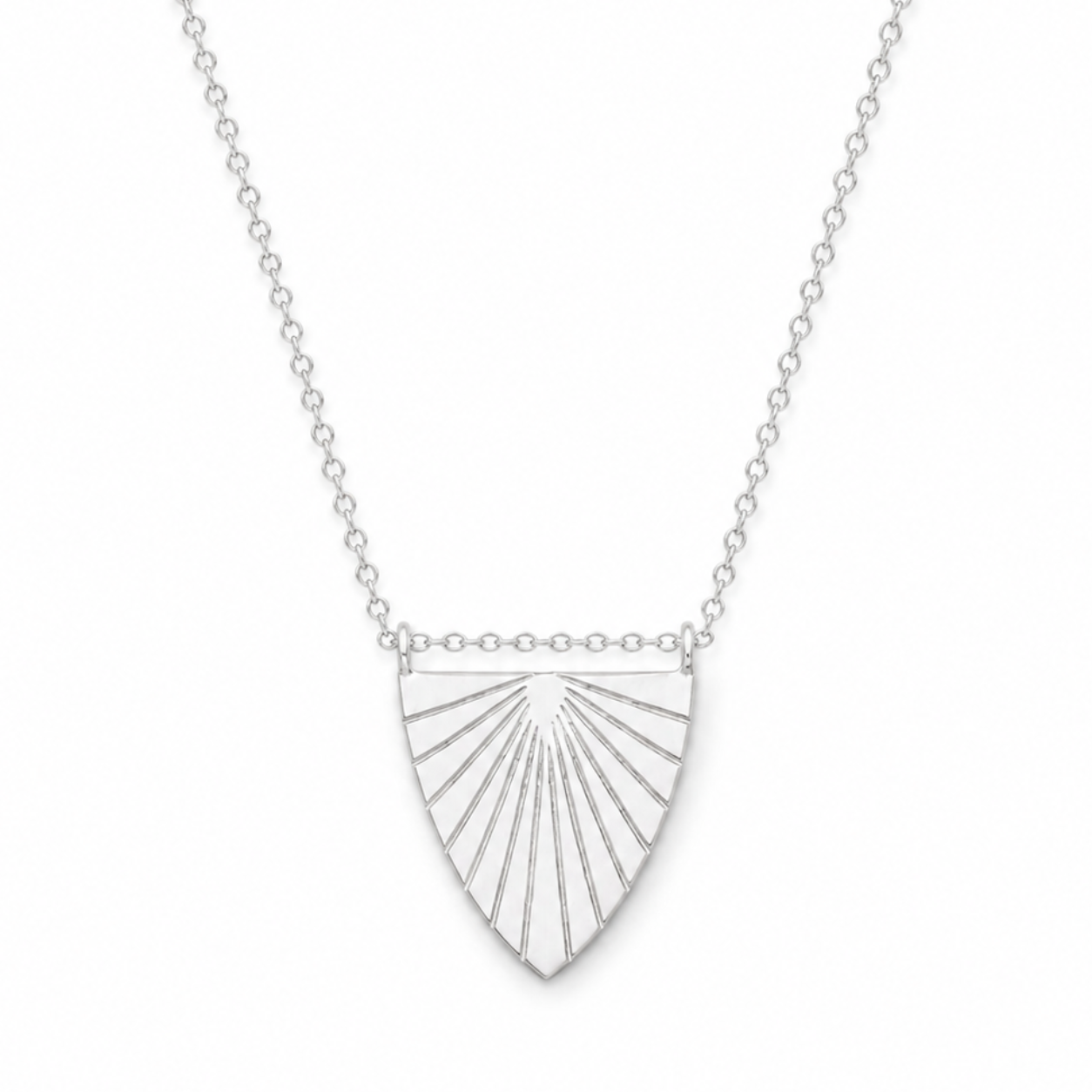 Silver necklace with a sunburst pendant on a white background