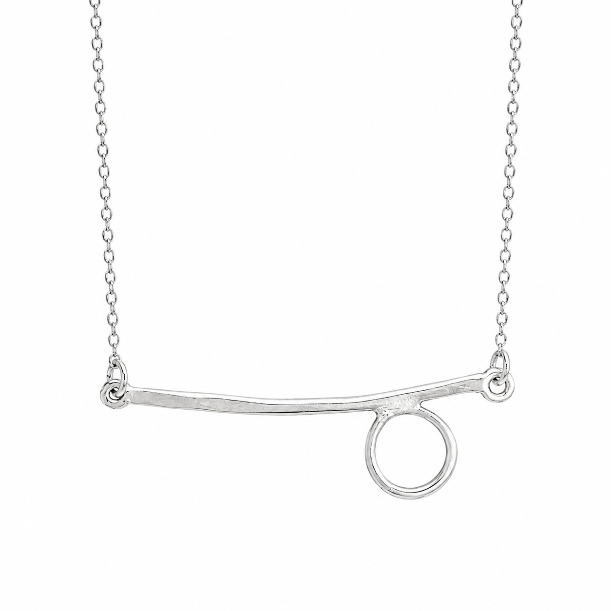 Silver necklace with a curved bar and circular end on a white background