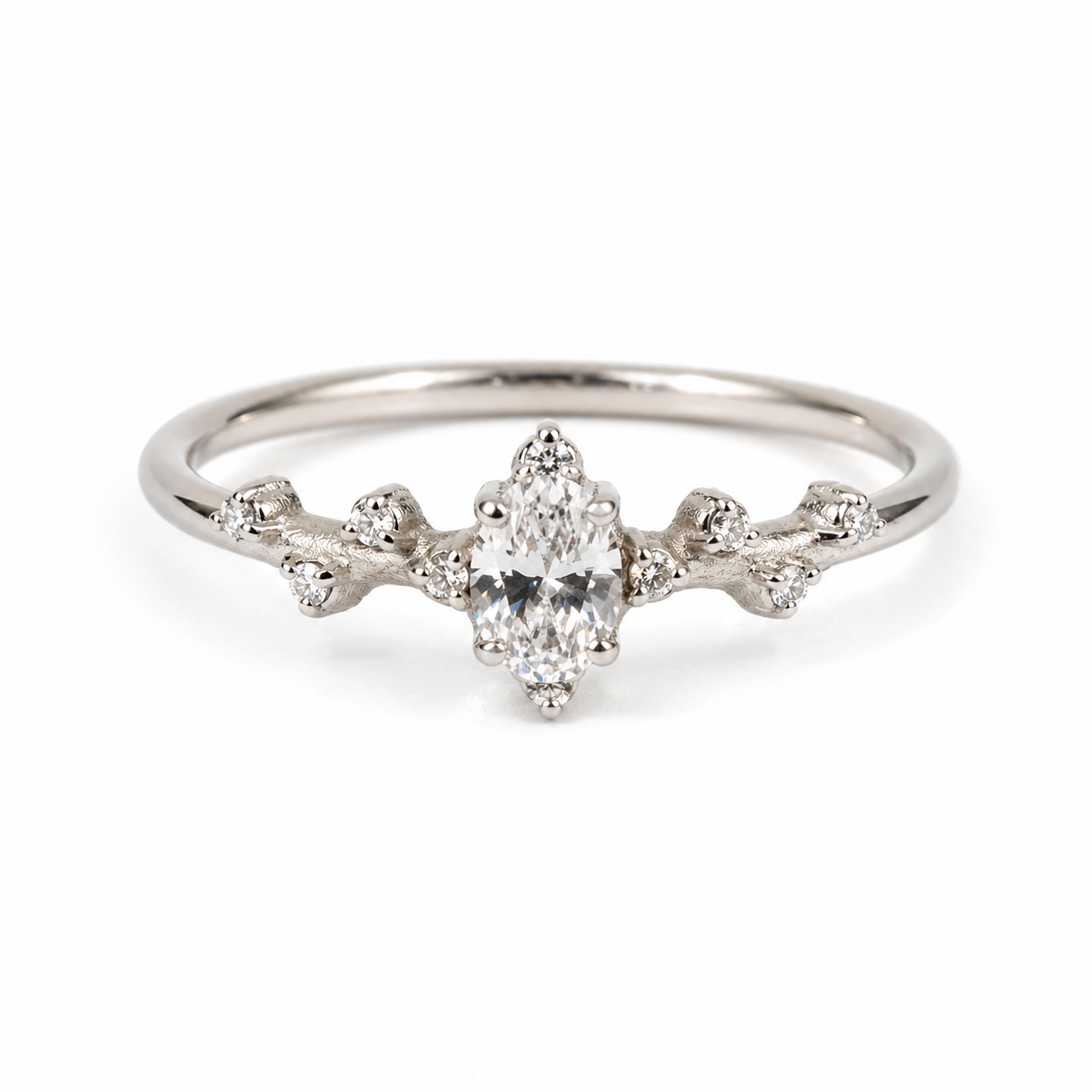 9k white gold  ring with a central diamond and smaller diamonds on a white background