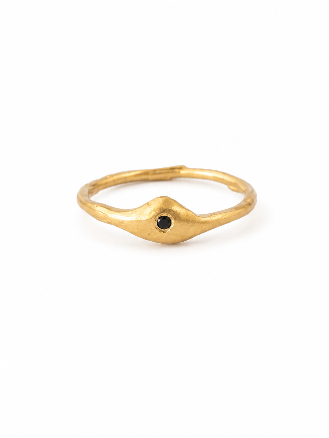 Gold ring with a black gemstone on a white background