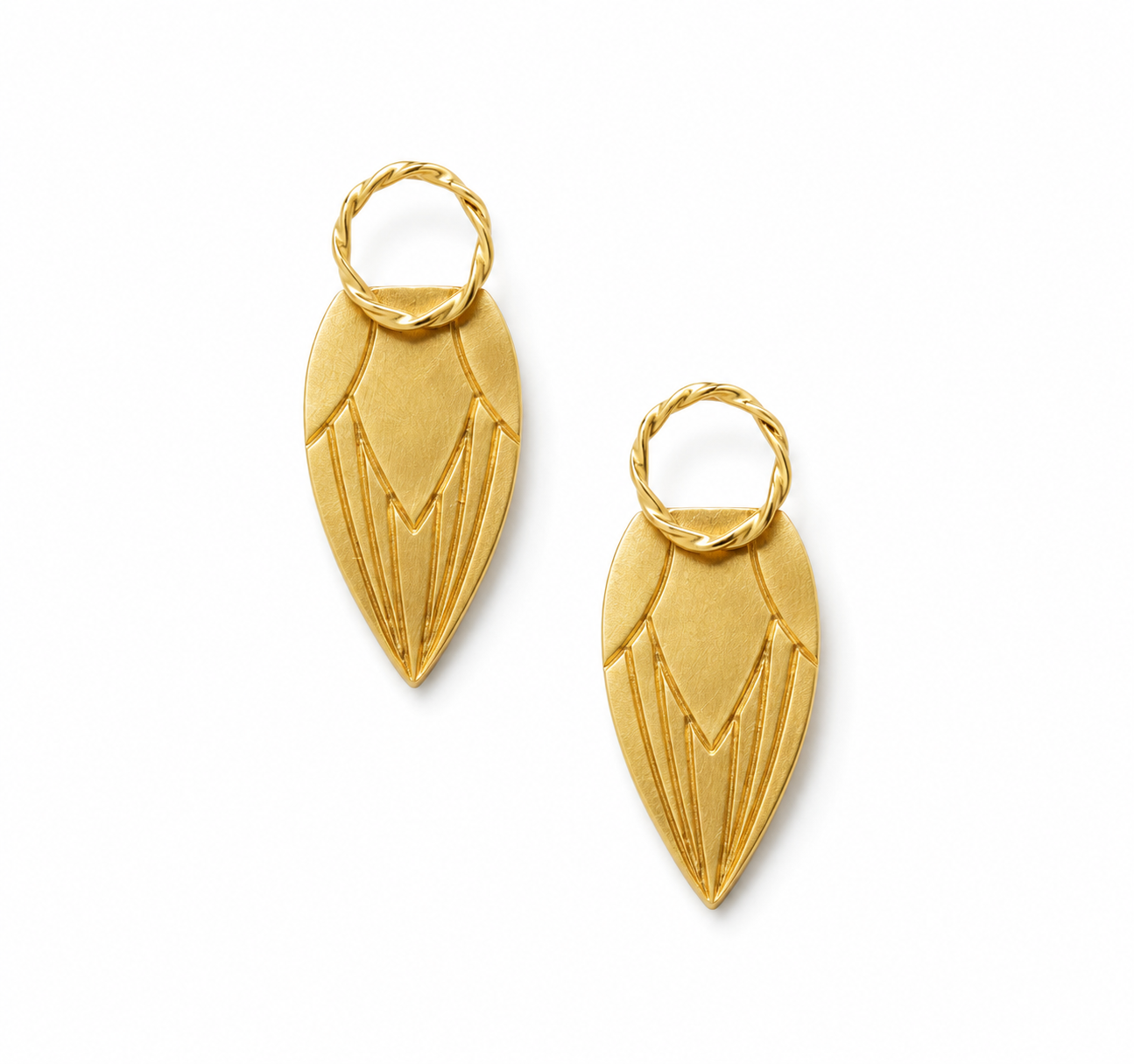 Pair of gold earrings on a white background