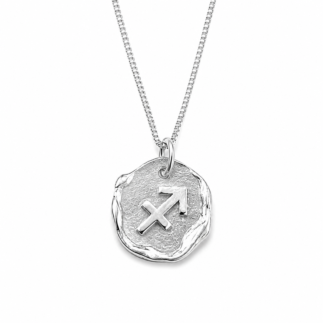 Silver necklace with a zodiac pendant on a white background